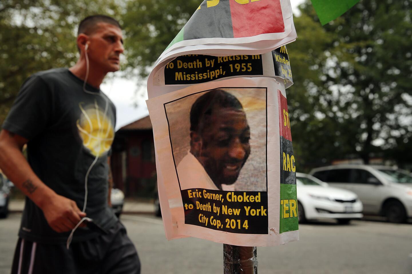 A flier with a picture of Eric Garner is seen Aug. 22, 2014, near where he was killed in an encounter with New York police officers in July in Staten Island.