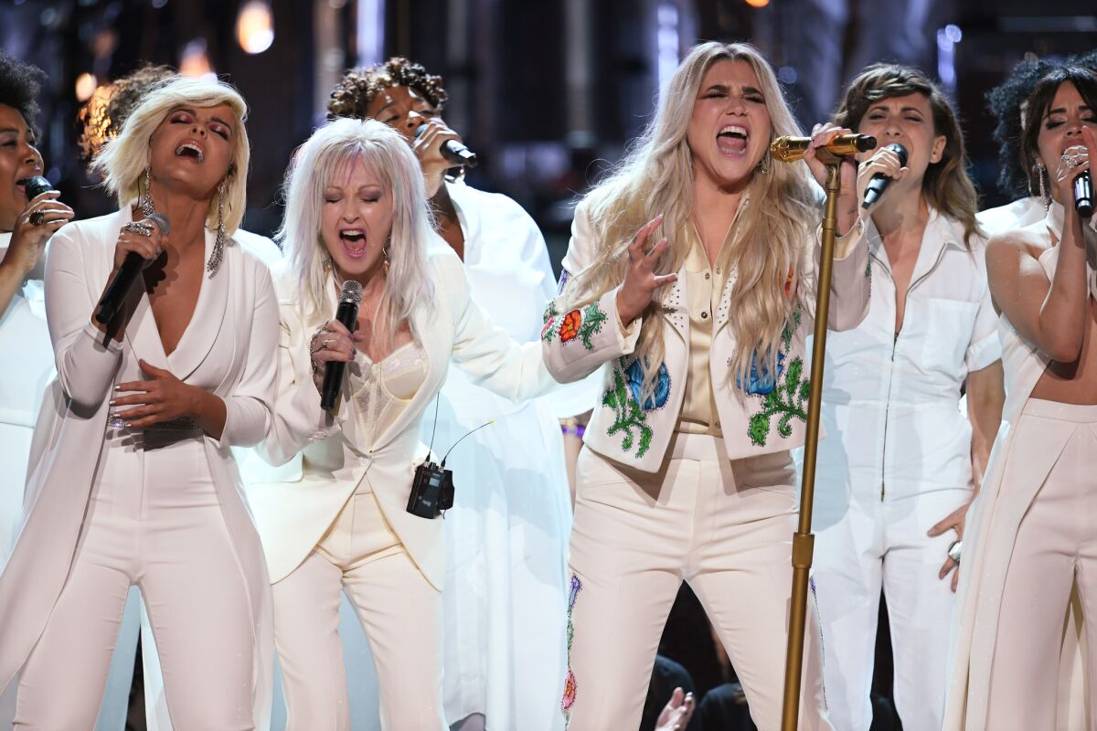 Kesha, center, with Bebe Rexha, left, Cyndi Lauper and Camila Cabello at the 60th Grammy Awards.
