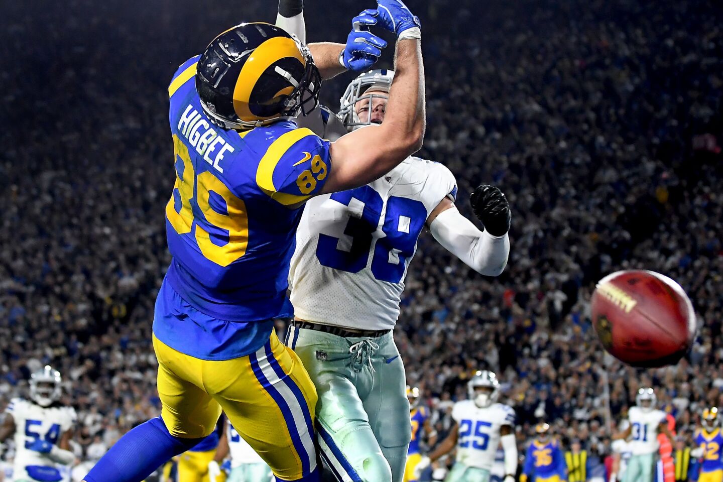 Rams tight end Tyler Higbee can't make the catch in the end zone as he's defended by Cowboys safety Jeff Heath.