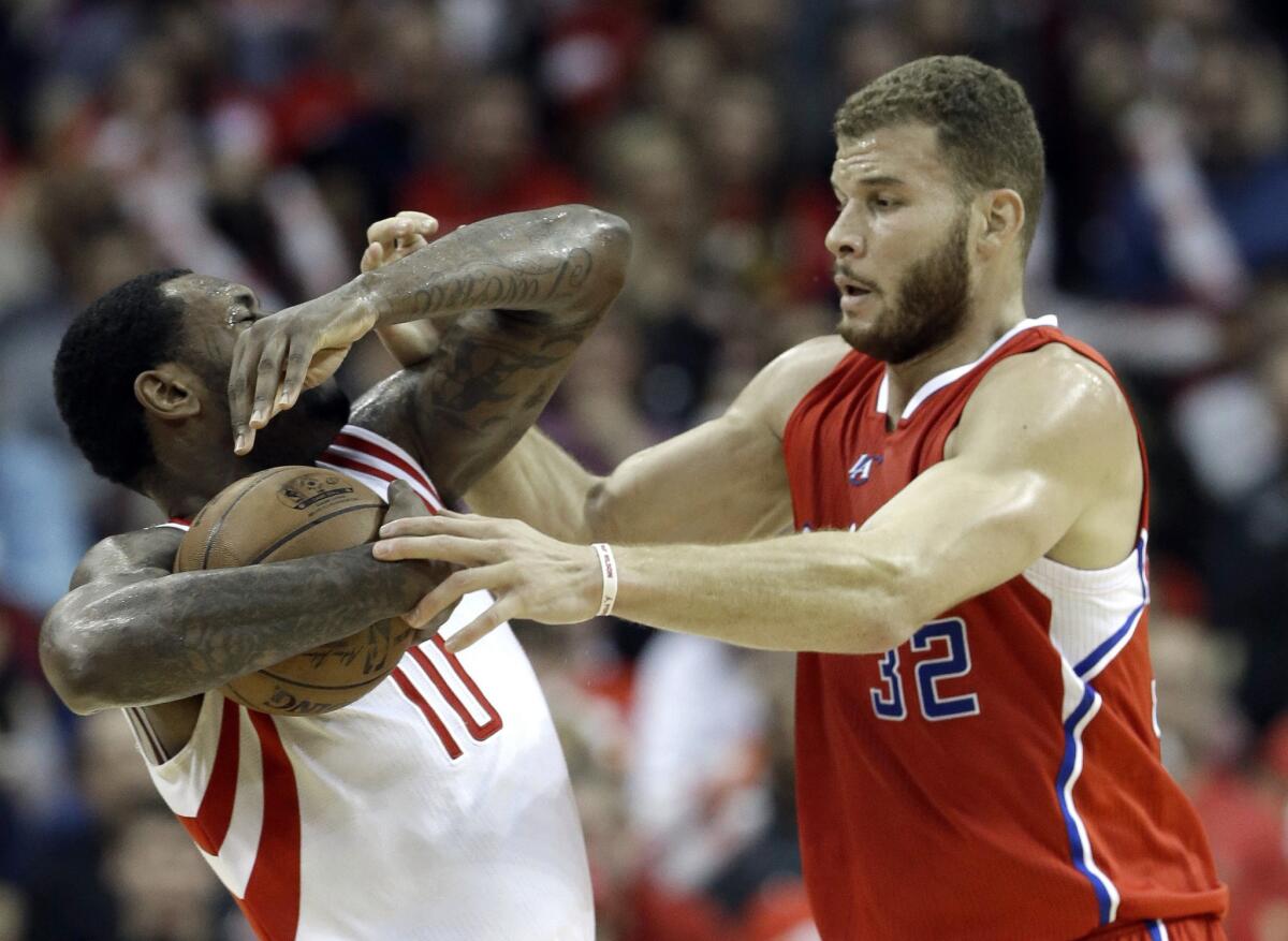 Clippers forward Blake Griffin tries to steal the ball from Rockets forward Tarik Black in the second half.