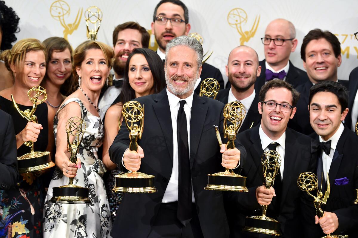 Jon Stewart and the cast and crew, winners of the award for outstanding variety talk series for "The Daily Show with Jon Stewart," pose in the press room at the 67th Primetime Emmy Awards on Sept. 20, 2015, at the Microsoft Theater in Los Angeles.