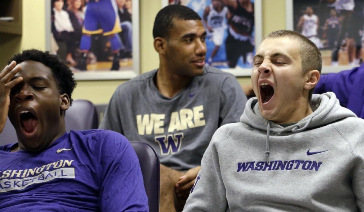 Members of the University of Washington basketball team yawn during a class on Chinese culture. A new study reveals our preindustrial ancestors didn't get eight hours of sleep at night either.