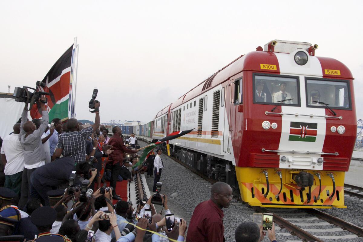 A cargo train travels on a Chinese-financed railway line in Mombasa, Kenya, in 2017.