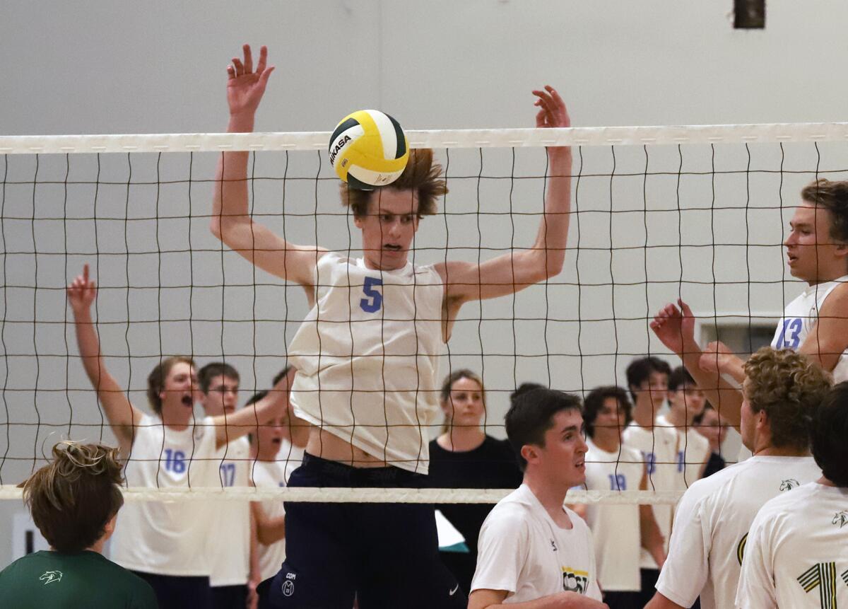 Corona del Mar's George Bruening (5) scores against Mira Costa on Thursday.