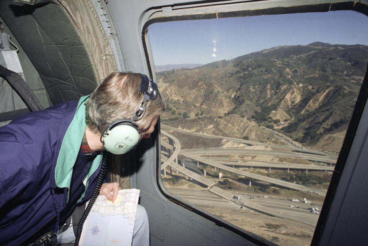 California Governor Pete Wilson views earthquake damage  from a helicopter in 1994.