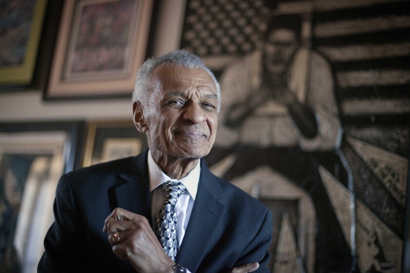 FILE - In this Jan. 4, 2012, file photo, civil rights activist C.T. Vivian poses in his home in Atlanta. Vivian, who worked alongside the Rev. Martin Luther King Jr., and served as head of the organization co-founded by the civil rights icon, was awarded the Presidential Medal of Freedom, and died in July 2020 in Atlanta. The mayor of Jackson, Miss., has declared Wednesday, May 26, 2021, as C.T. Vivian Day in Mississippi's capital city. (AP Photo/David Goldman, File)