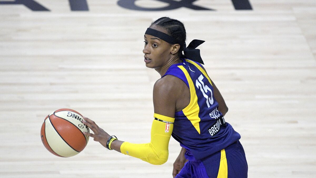 Sparks guard Brittney Sykes pushes the ball up the court.