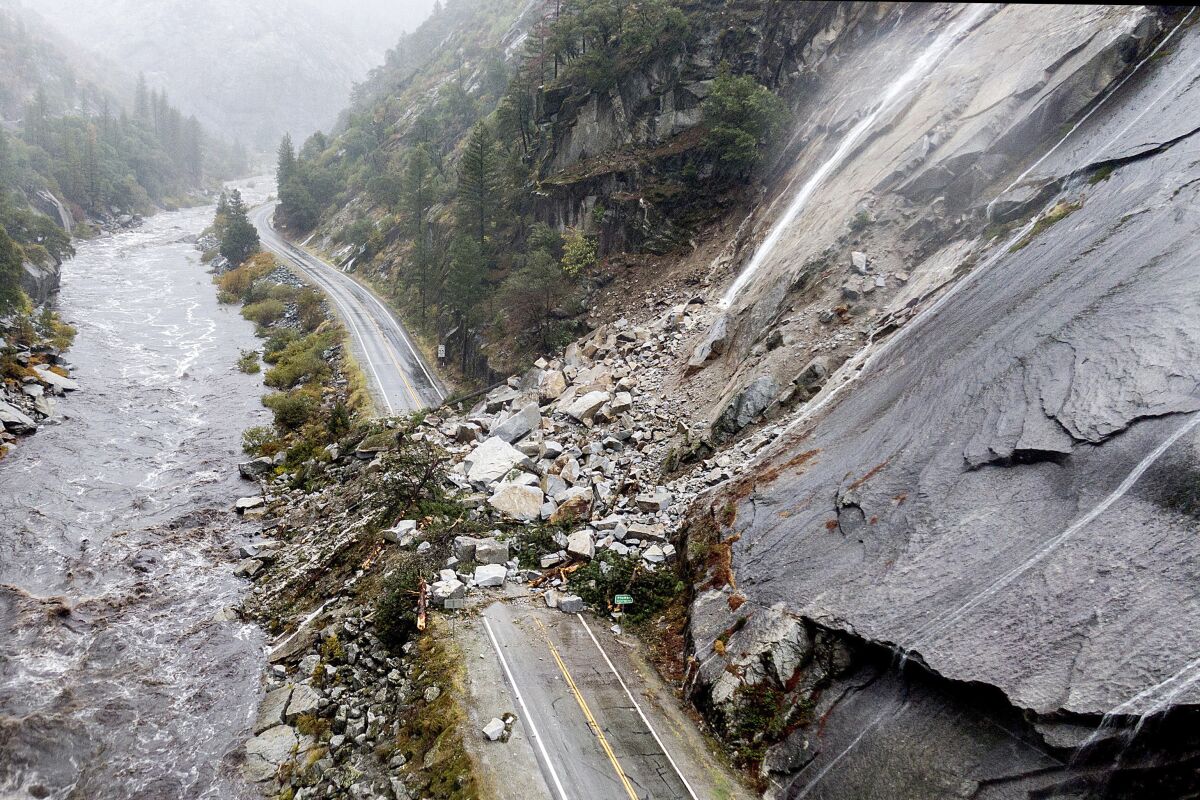 Rocks and vegetation cover Highway 70 following a landslide