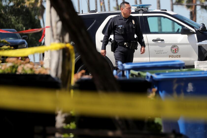 LOS ANGELES, CALIF. - MAR. 9, 2023. LAPD investigates the scene where three police officers were shot and wounded in Lincoln Heights following a shootout with a parolee at-large suspect who was shot and killed by the cops. he wounded officers were recovering and in stable condition on Thursday, Mar. 9, 2023. (Luis Sinco / Los Angeles Times)