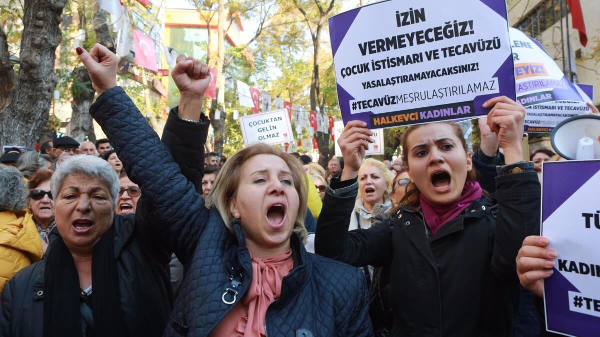 Protesters in Ankara, Turkey, demonstrate Nov. 19 against proposed legislation involving sexual assault. The placard reads: "We will not let you, rape cannot be legalized!"