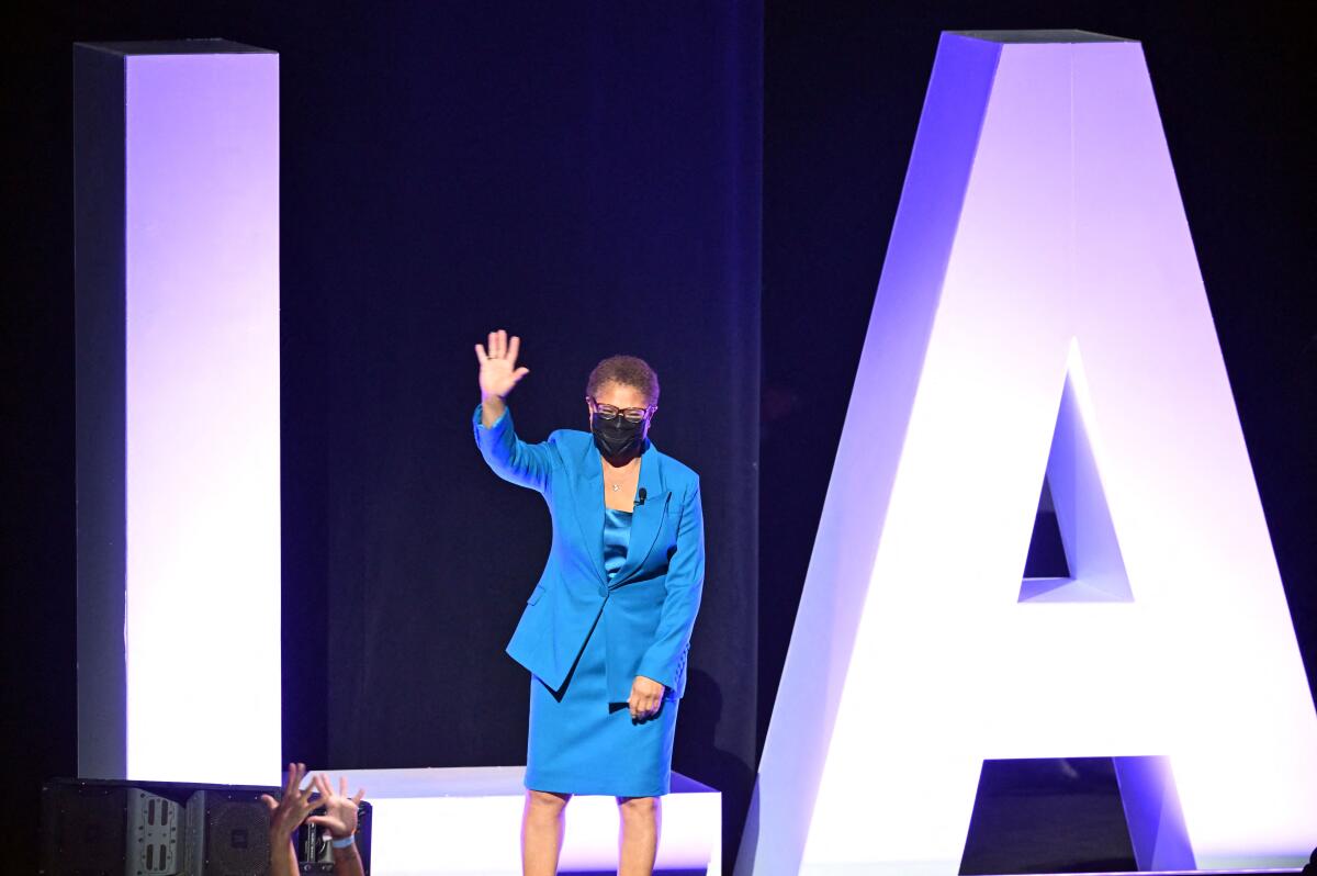 Mayor Karen Bass waving onstage