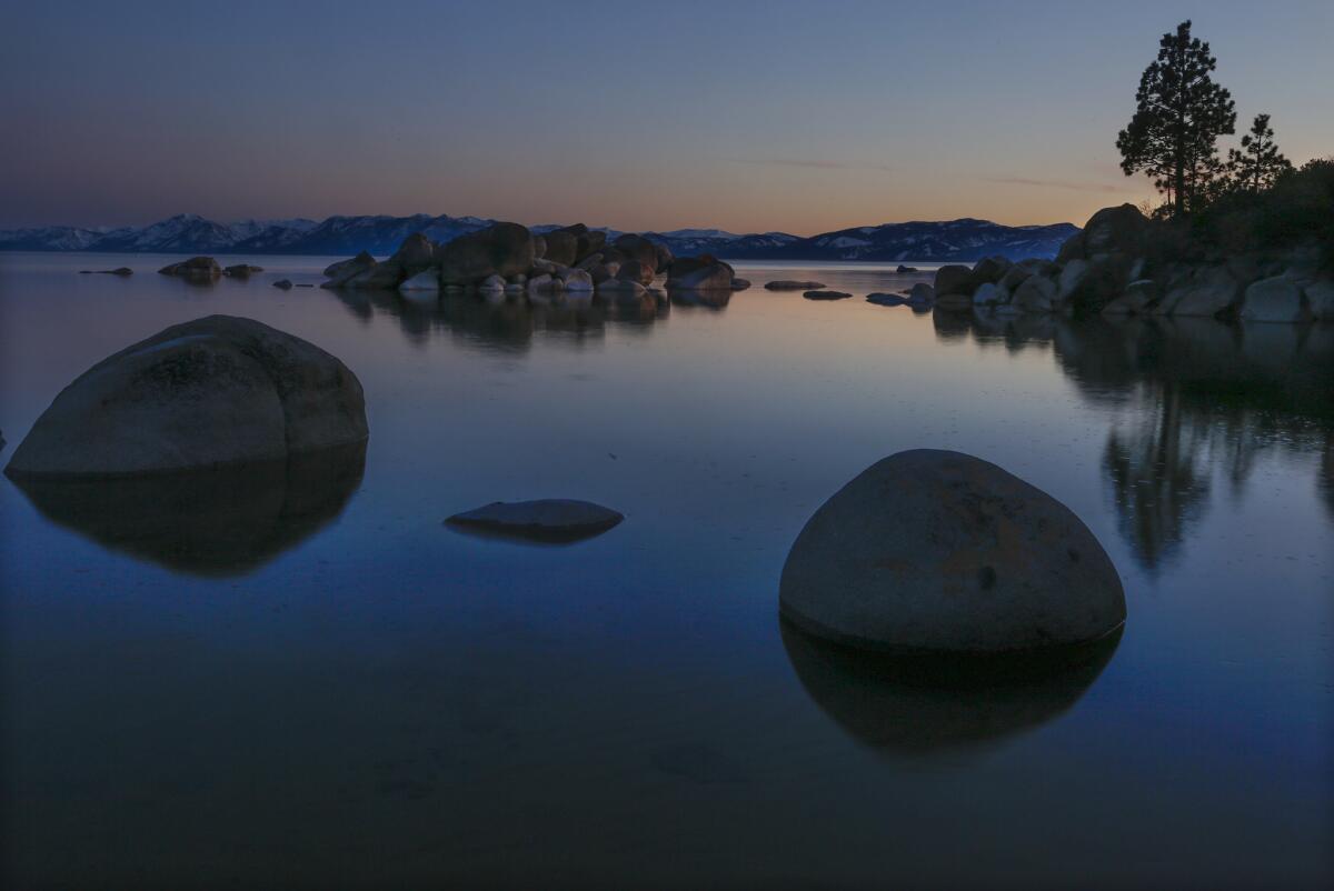 The large boulders on Speedboat Beach in North Lake Tahoe remain where Mark Twain is known to have played cards and camped. (Mark Boster / Los Angeles Times)
