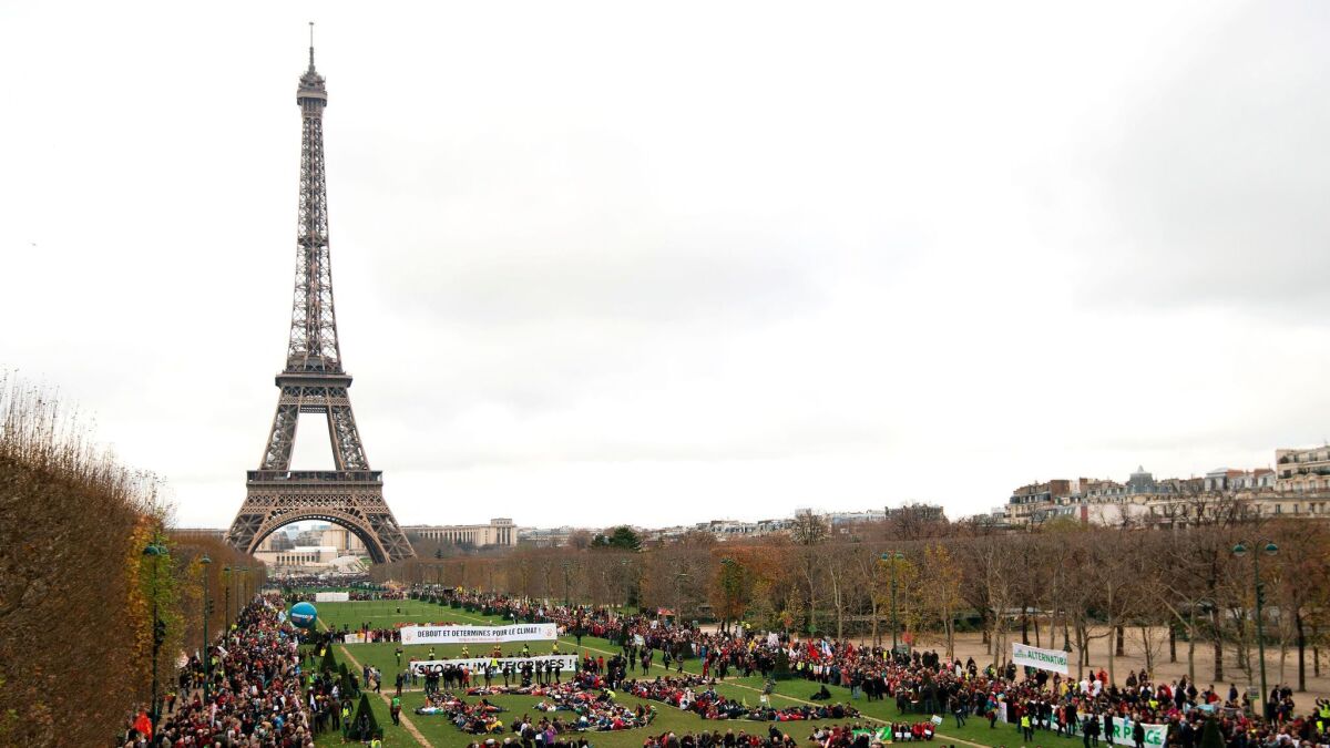 Activists gathered near the Eiffel Tower in Paris during the United Nations climate change conference on December 12, 2015.