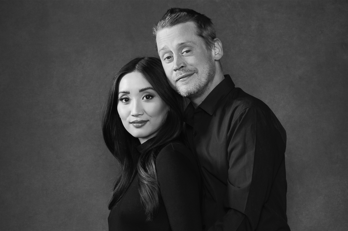 A black-and-white portrait of Brenda Song and Macaulay Culkin