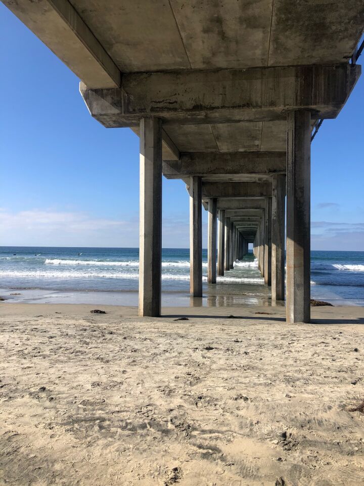 The underside of Scripps Pier gives the appearance of a tunnel to the sea.