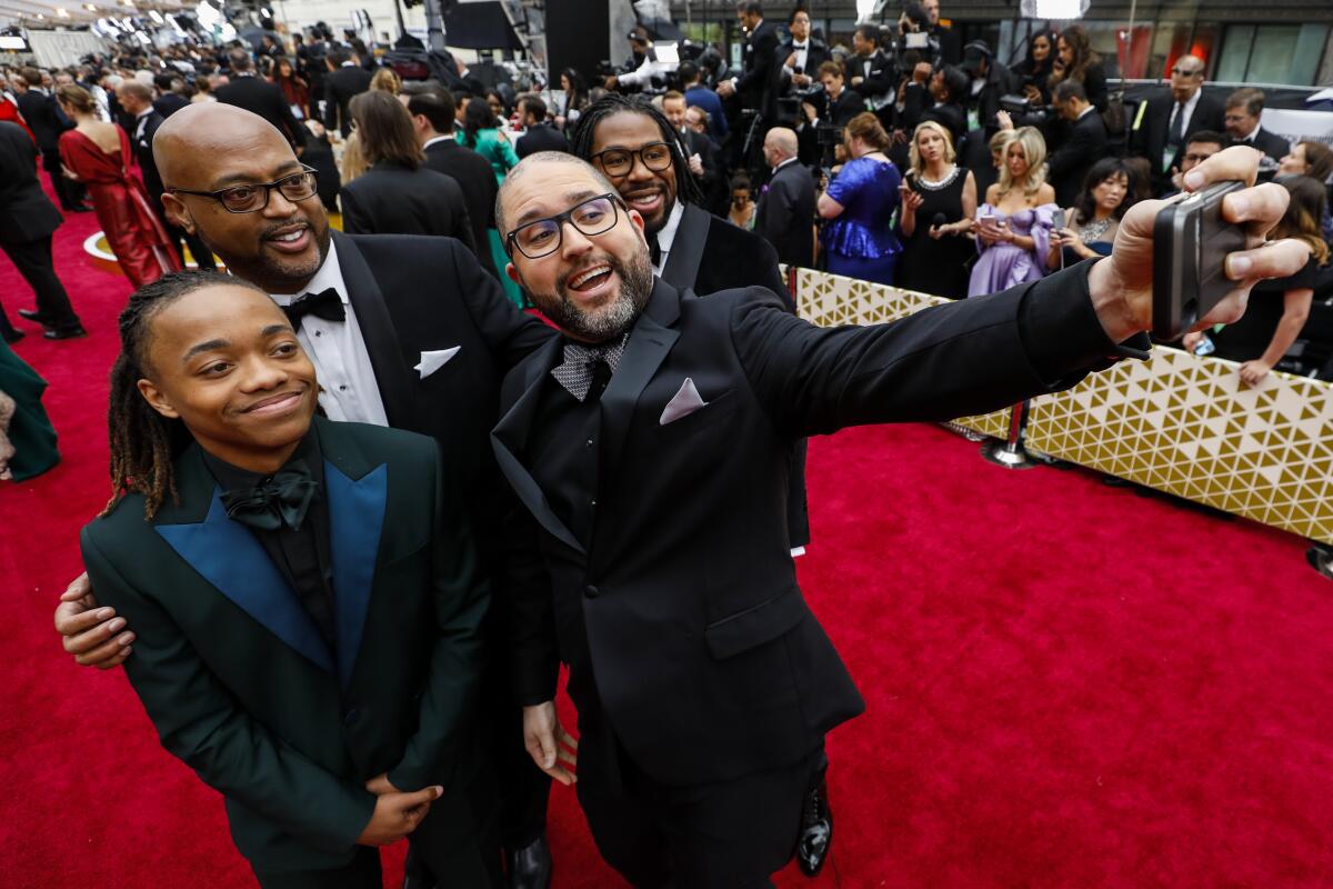 Parasite director Bong Joon Ho and cast members walking on the red carpet  at the 92nd Annual Academy Awards held at the Dolby Theatre in Hollywood,  California on Feb. 9, 2020. (Photo