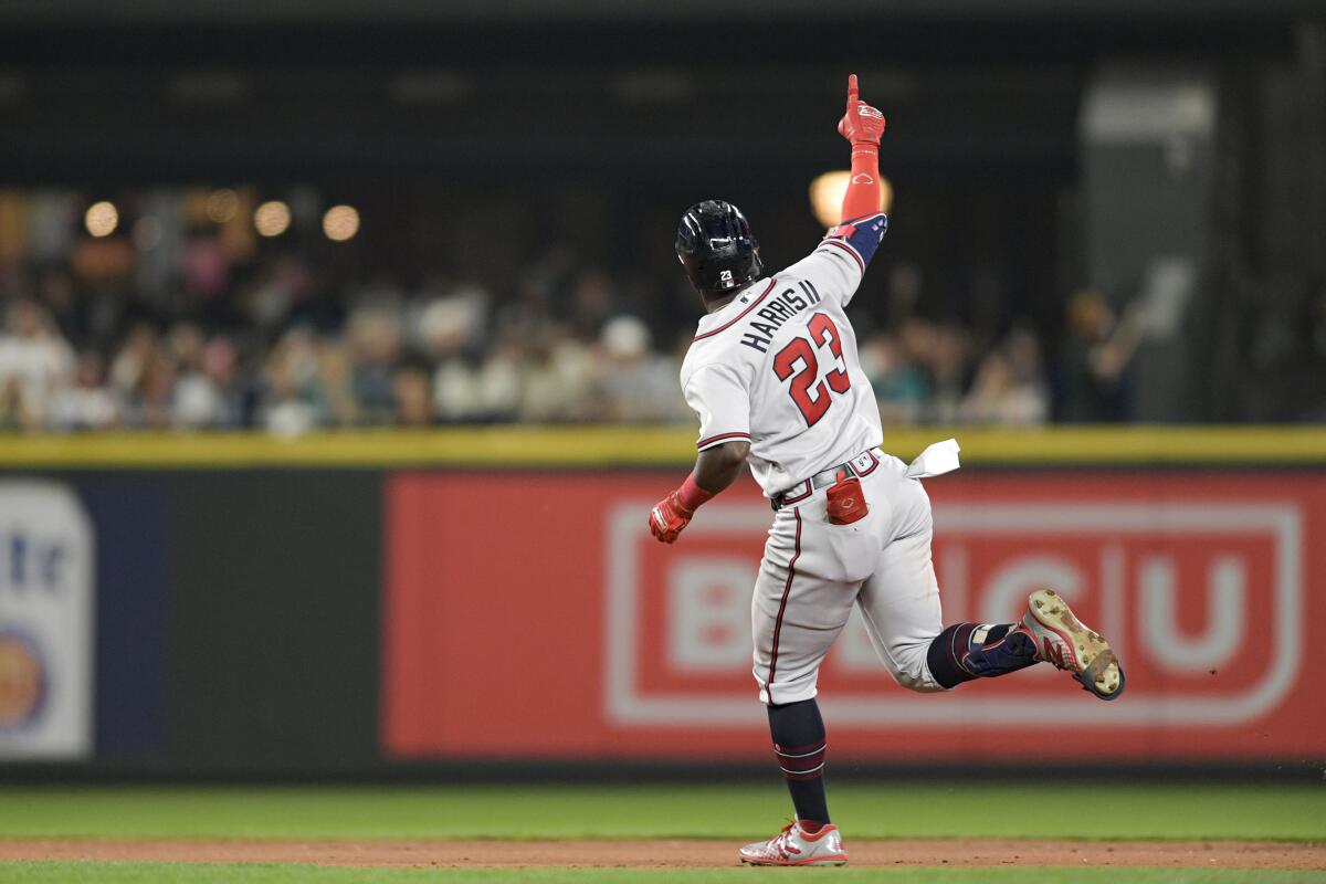 Atlanta Braves' Michael Harris II gestures as he runs the bases after hitting a solo home run during the sixth inning of the team's baseball game against the Seattle Mariners, Friday, Sept. 9, 2022, in Seattle. (AP Photo/Caean Couto)