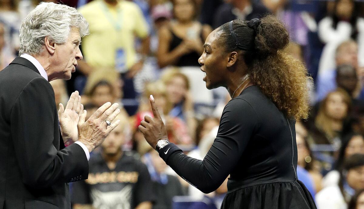 Serena Williams talks to referee Brian Earley after getting penalized during the second set of the U.S. Open final on Sept. 8, 2018.