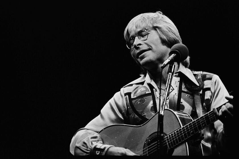 May 15, 1978: Celebration- John Denver, who sold out two conerts at the Inglewood Forum, showed added range and dimension in his music during performance Monday night. This photo was published in the May 17, 1978 Los Angeles Times. This image is from the Los Angeles Times Archive at UCLA.
