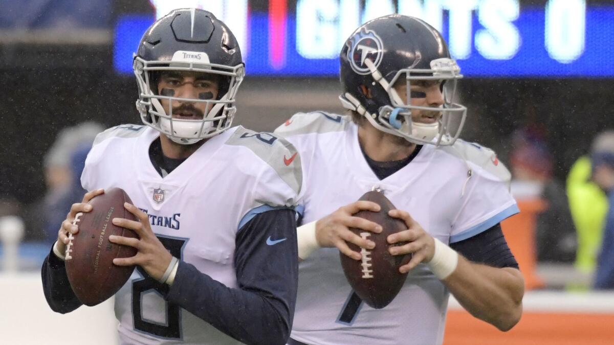Tennessee Titans quarterback Marcus Mariota (8) and quarterback Blaine Gabbert (7) work out prior to a game against the New York Giants on Dec. 16, 2018, in East Rutherford, N.J.