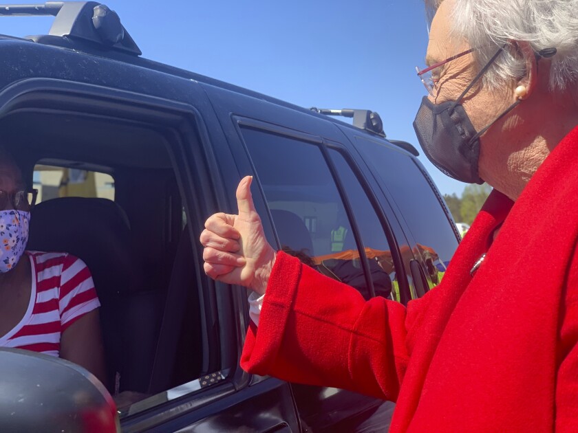 Alabama Gov. Kay Ivey gives a thumbs up to Doris Coleston after Coleston received a COVID-19 vaccination at a clinic in Camden, Ala. on Friday, April 2, 2021. (AP Photo/Kim Chandler)