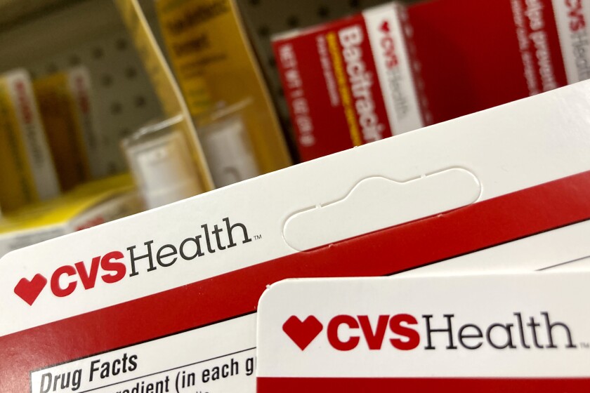 CVS Health products are displayed at a store, Monday, May 3, 2021, in North Andover, Mass. CVS Health is hiking its dividend and offering a better-than-expected 2022 revenue forecast as the health care giant prepares to dive deeper into providing more care. (AP Photo/Elise Amendola)