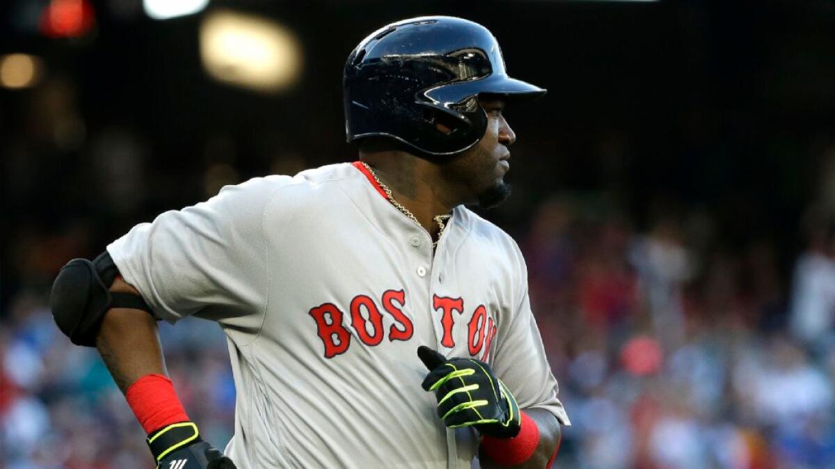 Red Sox designated hitter David Ortiz runs to first after hitting a single during the first inning of a game against the Seattle Mariners on Aug. 4.