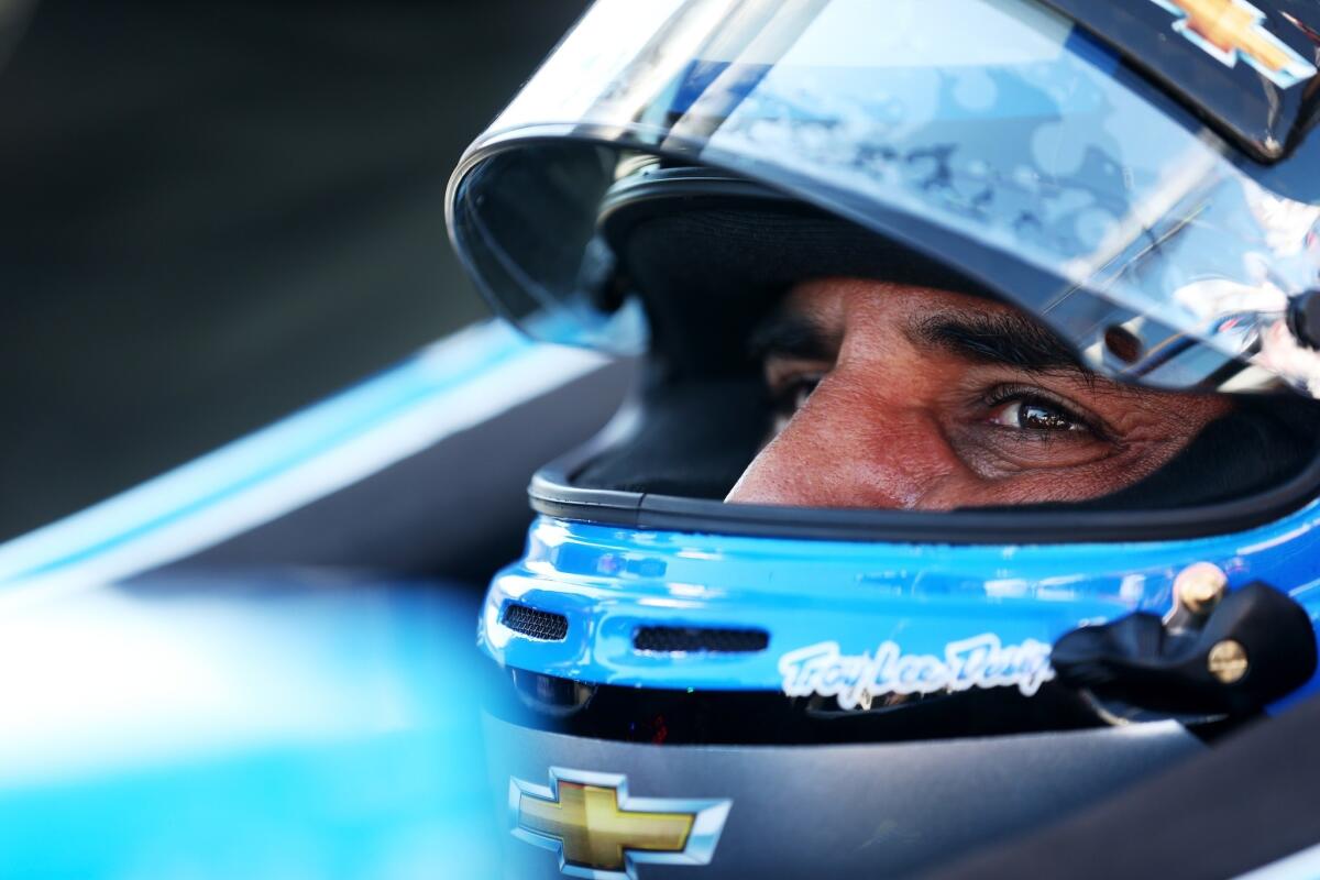 Juan Pablo Montoya sits in his car during practice for the Honda Indy Car Grand Prix of Alabama at Barber Motorsports Park in Birmingham.