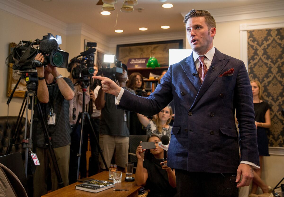 White nationalist Richard Spencer, the self-described creator of the term "alt-right," speaks to select media in his office space in Alexandria, Va., on Aug. 14.