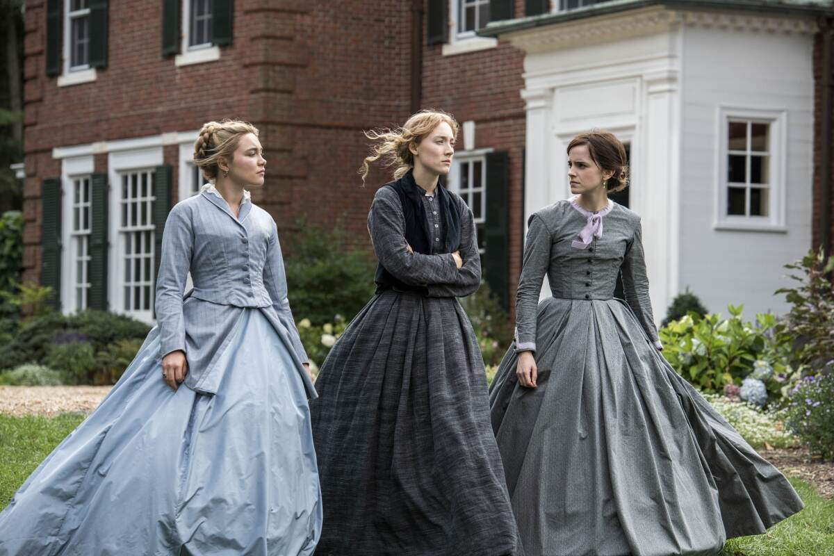 Florence Pugh, left, Saoirse Ronan and Emma Watson in "Little Women."