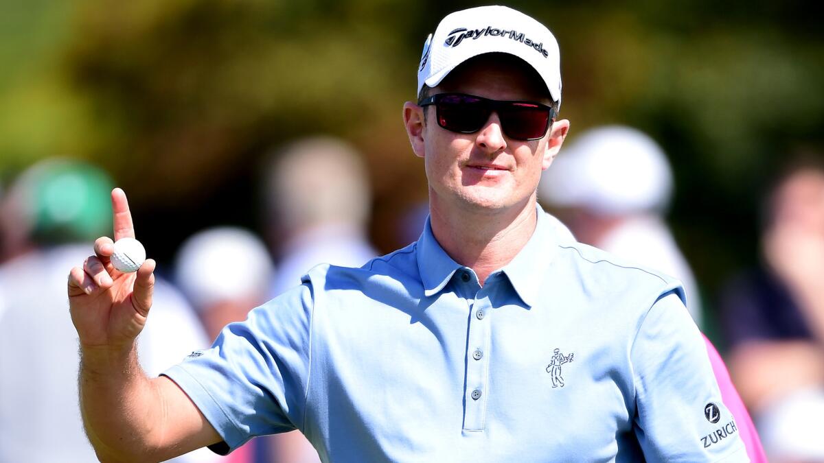 Justin Rose acknowledges the fans after putting for par at No. 18 on Thursday to complete the first round of the Masters.