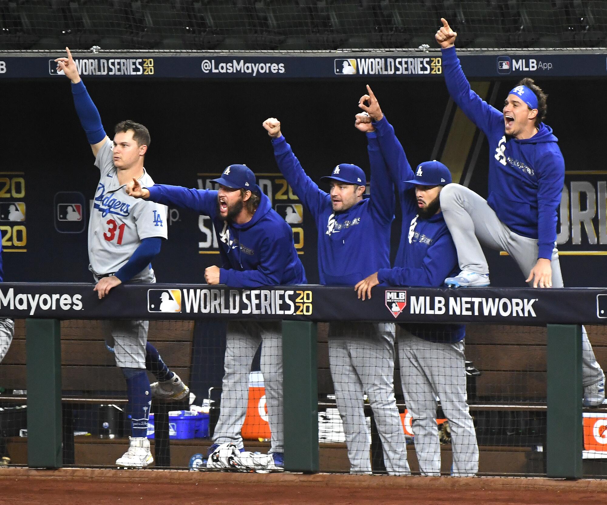 ARLINGTON, TEXAS OCTOBER 23, 2020-The Dodgers dugout celebrates a solo home run by Justin Turner.