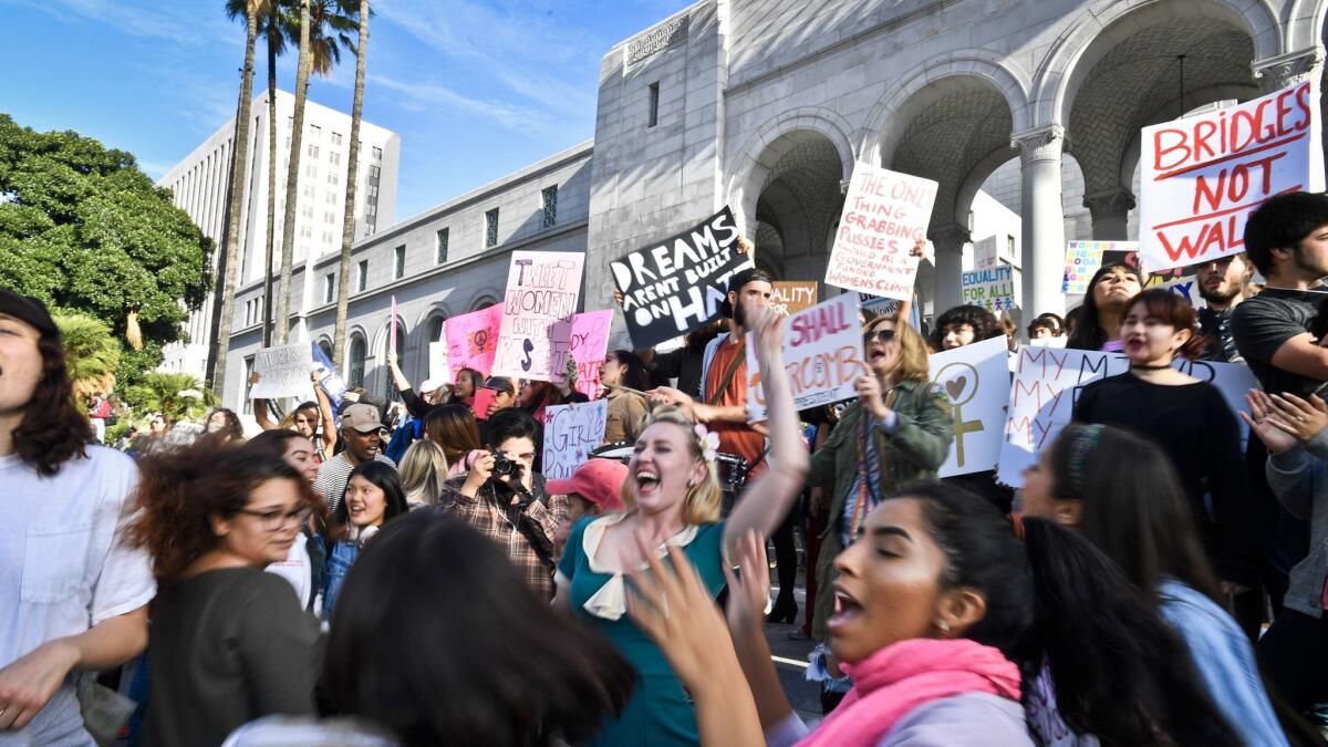 Participants in Saturday's march for women's rights gather outside City Hall in Los Angeles.