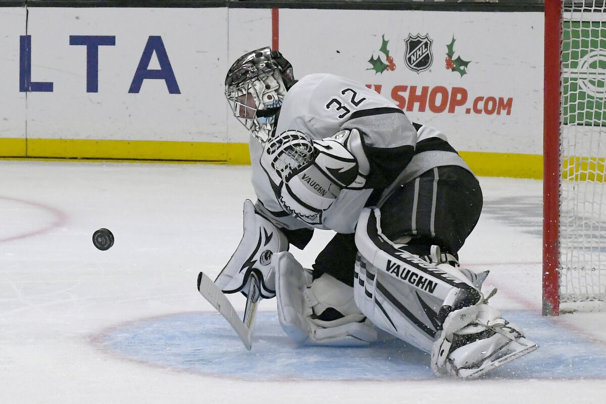 Los Angeles Kings goaltender Jonathan Quick stops a shot by the Minnesota Wild during the first period in an NHL hockey game Saturday, Dec. 11, 2021, in Los Angeles. (AP Photo/John McCoy)