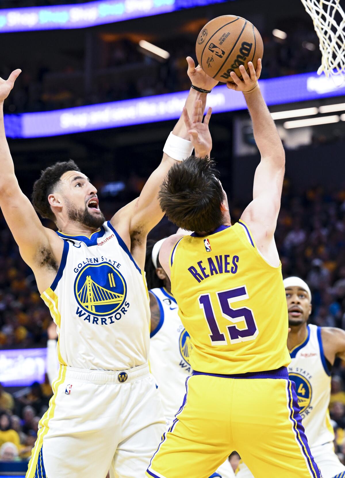 Lakers guard Austin Reaves tries to loft a shot over Warriors guard Klay Thompson during Game 5.
