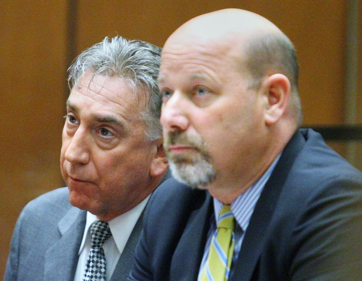 Former Glendale Mayor John Drayman, with his attorney Sean McDonald, at his sentencing at Superior Court in Los Angeles on Monday, April 7, 2014 for embezzling proceeds from the Montrose Farmer's Market, and filing false tax returns. His sentence is 365 days in county jail, with 4 days credit for time served, and to pay restitution and all court fees.