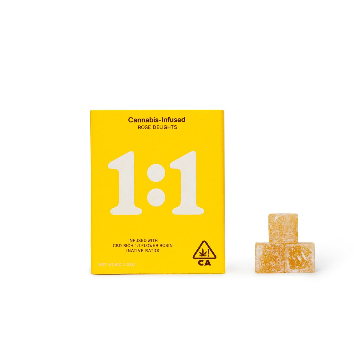 A square yellow box of Cannabis-Infused Rose Delights next to a pyramid of three cannabis-infused edibles.
