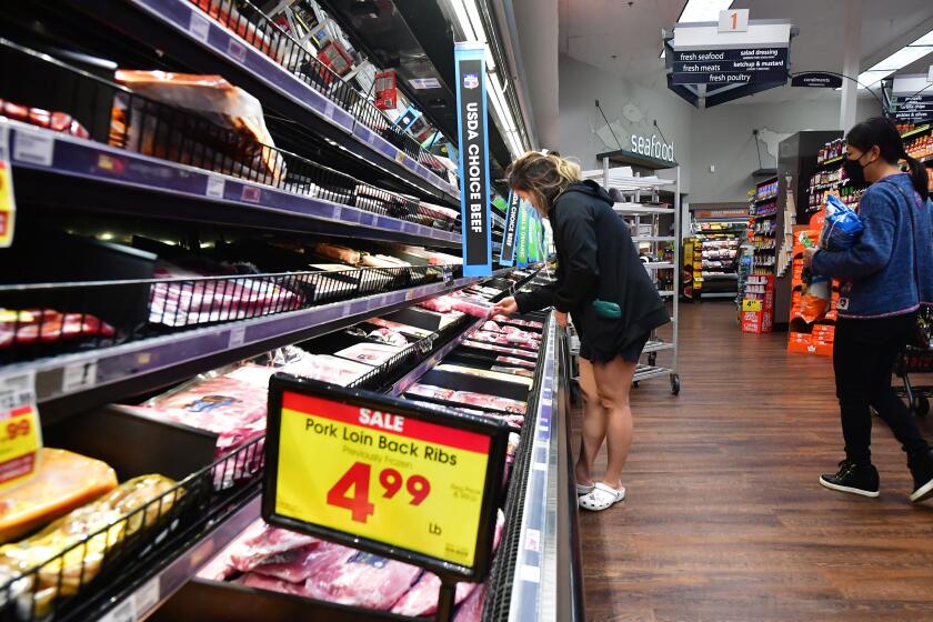 People shop at a grocery store in Monterey Park, California, on April 12, 2022. - Americans paid more for gasoline, food and other essentials last month amid an ongoing wave of record inflation made worse by Russia's invasion of Ukraine, according to government data released Tuesday. (Photo by Frederic J. BROWN / AFP) (Photo by FREDERIC J. BROWN/AFP via Getty Images)