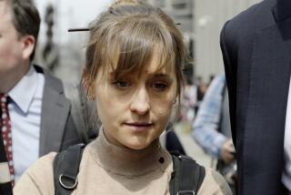 FILE - Television actor Allison Mack leaves federal court in the Brooklyn borough of New York, April 8, 2019, after pleading guilty to racketeering charges in a case involving a cult-like group based in upstate New York called NXIVM. Mack has been released from a California prison, according to a government website. Online records maintained by the Federal Bureau of Prisons said she was released Monday, July 3, 2023. (AP Photo/Mark Lennihan, File)