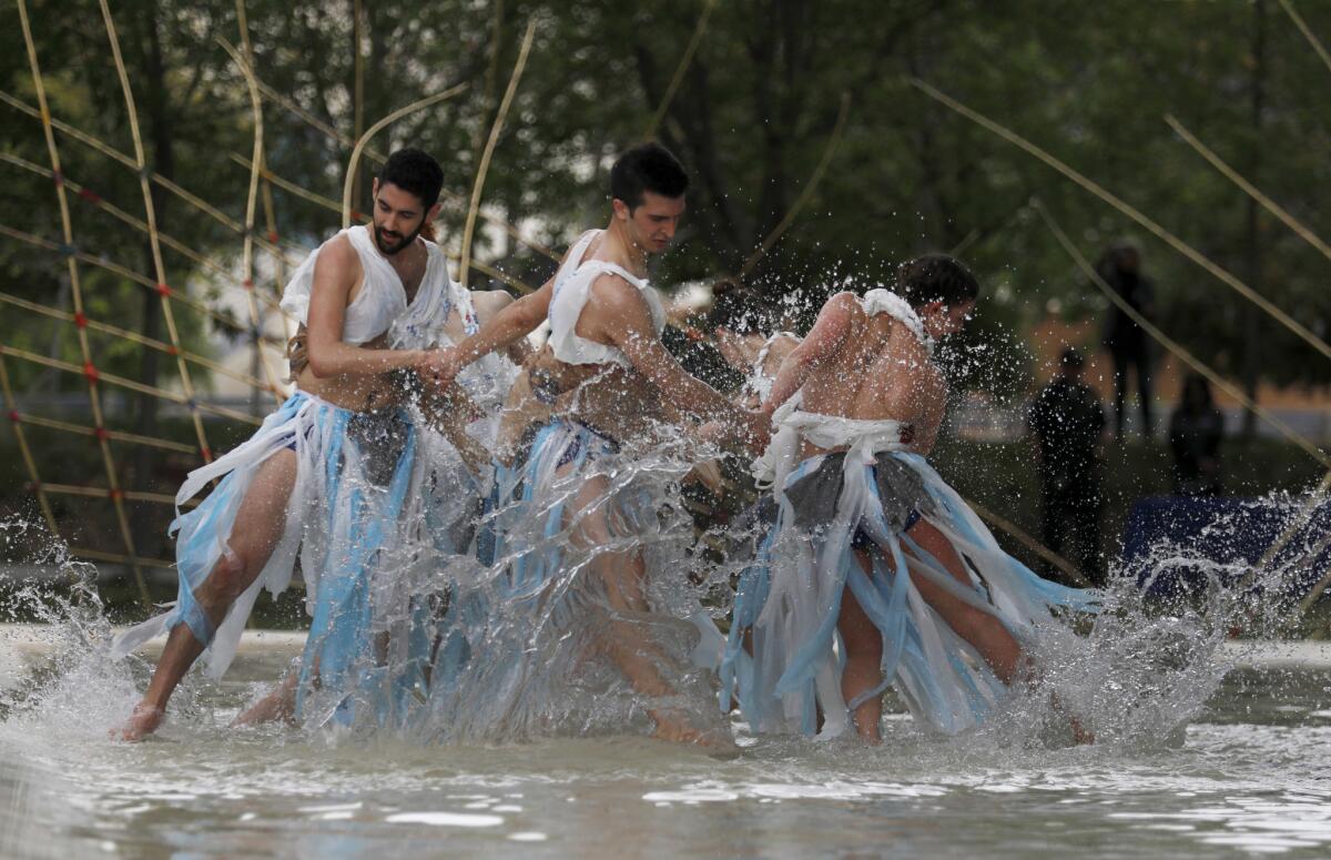 Neuman’s Artichoke Dance Company dancers, wearing costumes made out of plastic bags, perform “Visioning Bodies."