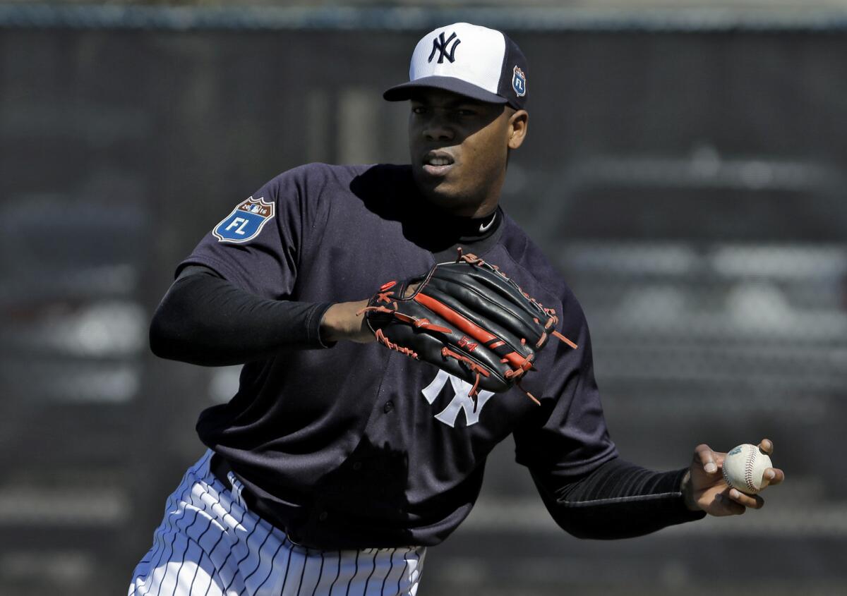 New York Yankees pitcher Aroldis Chapman throws during a spring training workout in Tampa, Fla., on Feb. 19.