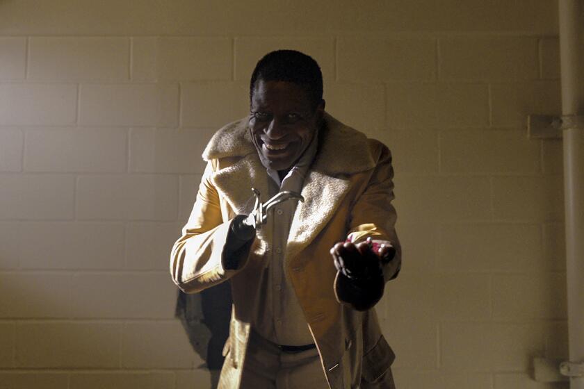 This image released by Universal Pictures shows Michael Hargrove as Sherman Fields in a scene from "Candyman," directed by Nia DaCosta. (Universal Pictures and MGM Pictures via AP)