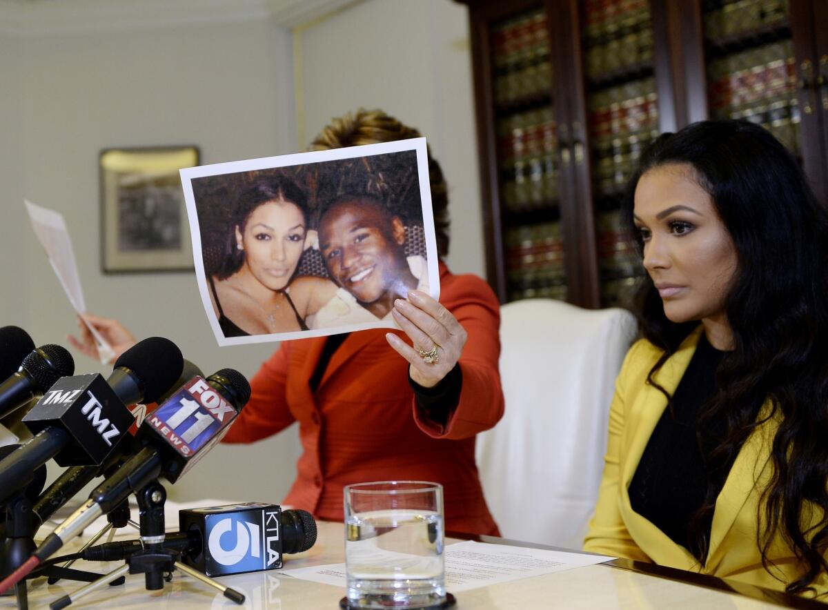 Floyd Mayweather Jr.'s ex-girlfriend Shantel Jackson, right, at a news conference after announcing a lawsuit against the boxer. Gloria Allred is her attorney.