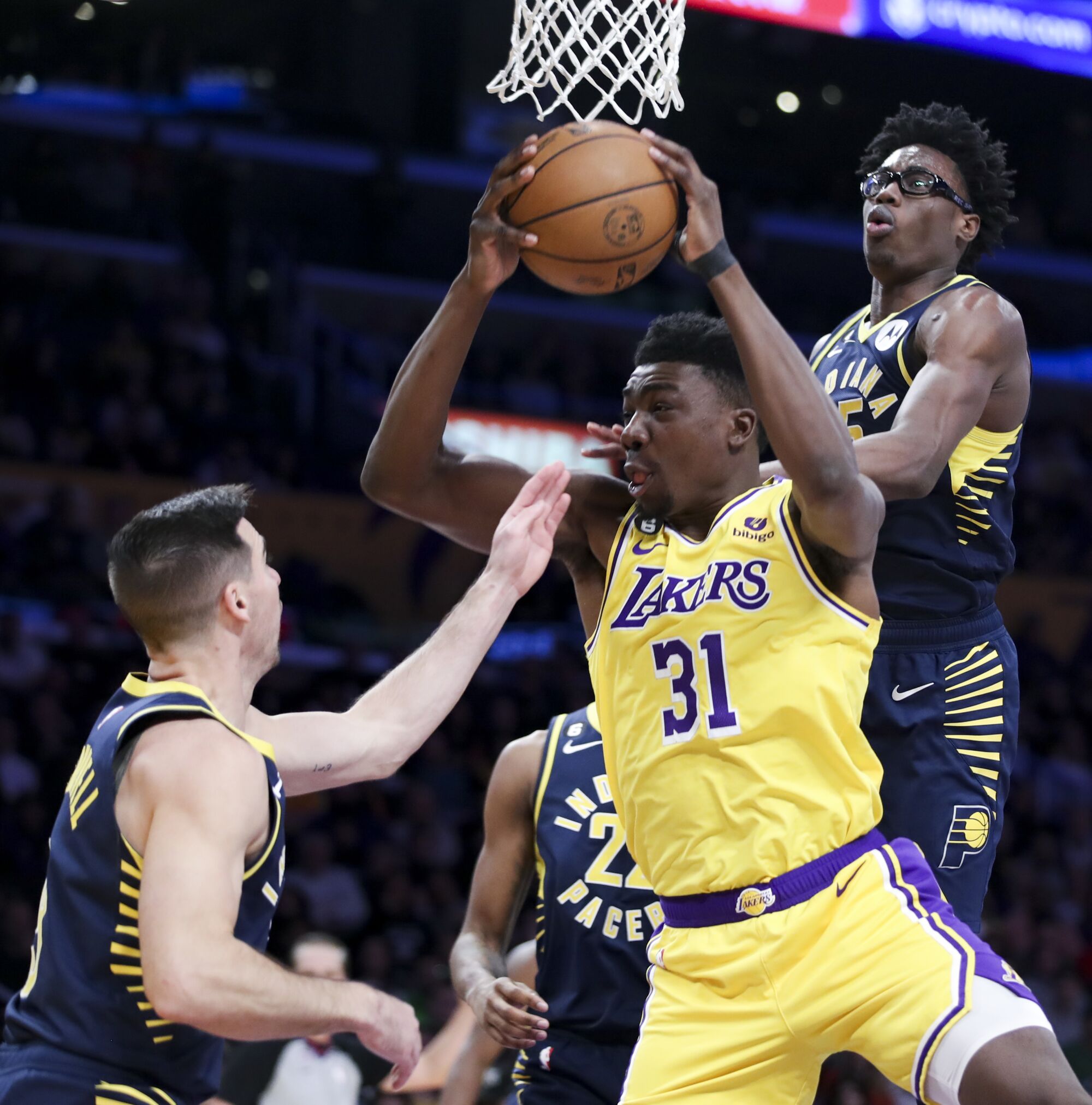 Lakers center Thomas Bryant grabs a rebound against the Pacers.