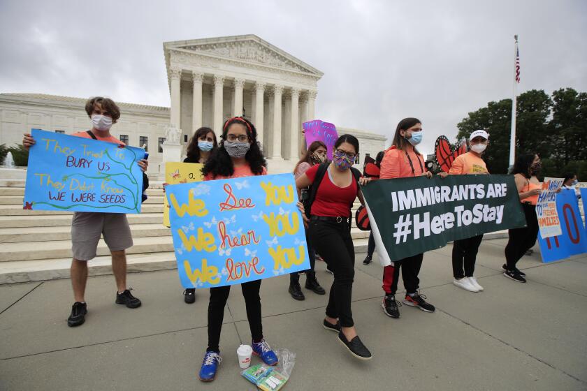 Deferred Action for Childhood Arrivals (DACA) students celebrate in front of the Supreme Court after the Supreme Court rejected President Donald Trump's effort to end legal protections for young immigrants, Thursday, June 18, 2020, in Washington. (AP Photo/Manuel Balce Ceneta)