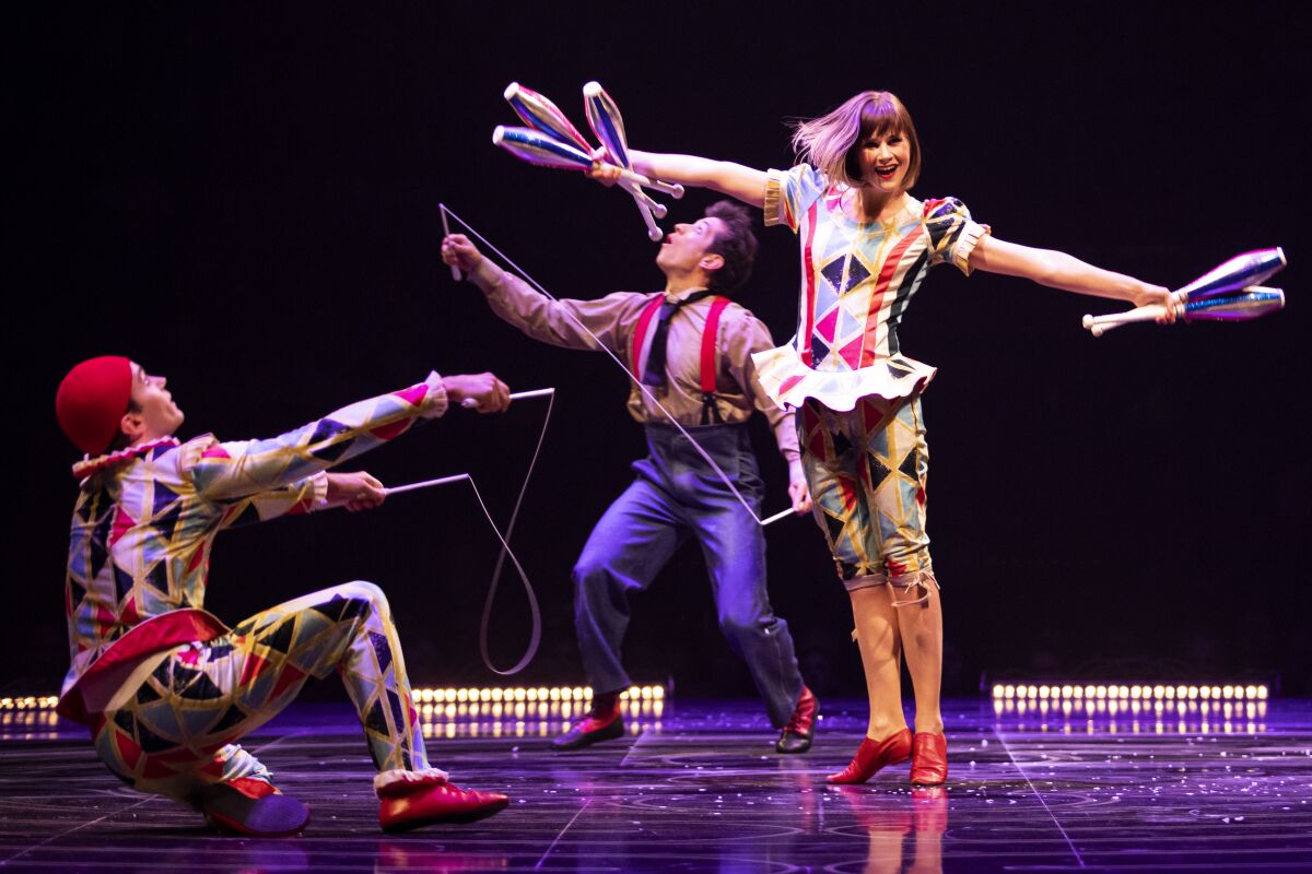 Three performers in Cirque du Soleil's "Corteo"