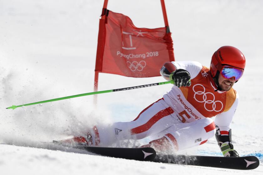 FILE - Austria's Marcel Hirscher skis to the gold medal in the second run of the men's giant slalom at the 2018 Winter Olympics in Pyeongchang, South Korea, Sunday, Feb. 18, 2018. Marcel Hirscher, one of the most successful ski racers of all time, is planning to return next season after five years in retirement. And the record eight-time overall World Cup champion is going to compete for the Netherlands — his mother's country — instead of his native Austria. (AP Photo/Luca Bruno, File)
