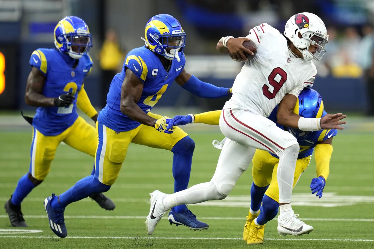 Arizona Cardinals quarterback Joshua Dobbs is tackled by Rams safety Quentin Lake in the second half.