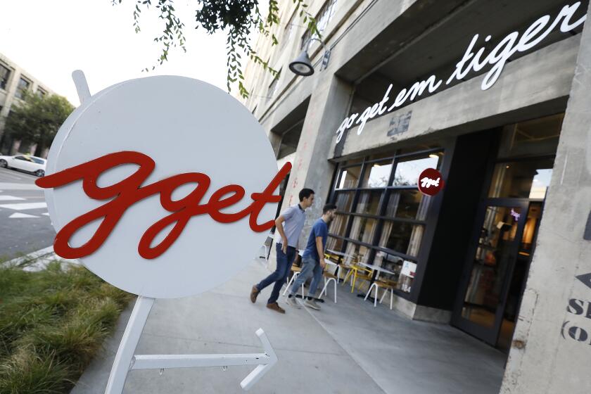 LOS ANGELES, CA - AUGUST 29, 2019 Patrons enter the cafe Go Get Em Tiger located at The ROW on 777 South Alameda St. in Los Angeles operated by owners Kyle Glanville and Charles Babinski on August 29, 2019.(Al Seib / Los Angeles Times)