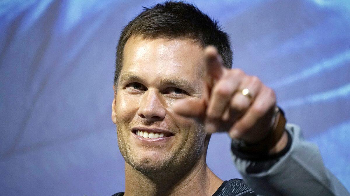 New England Patriots quarterback Tom Brady gestures during a promotional event on June 22 in Tokyo, Japan.